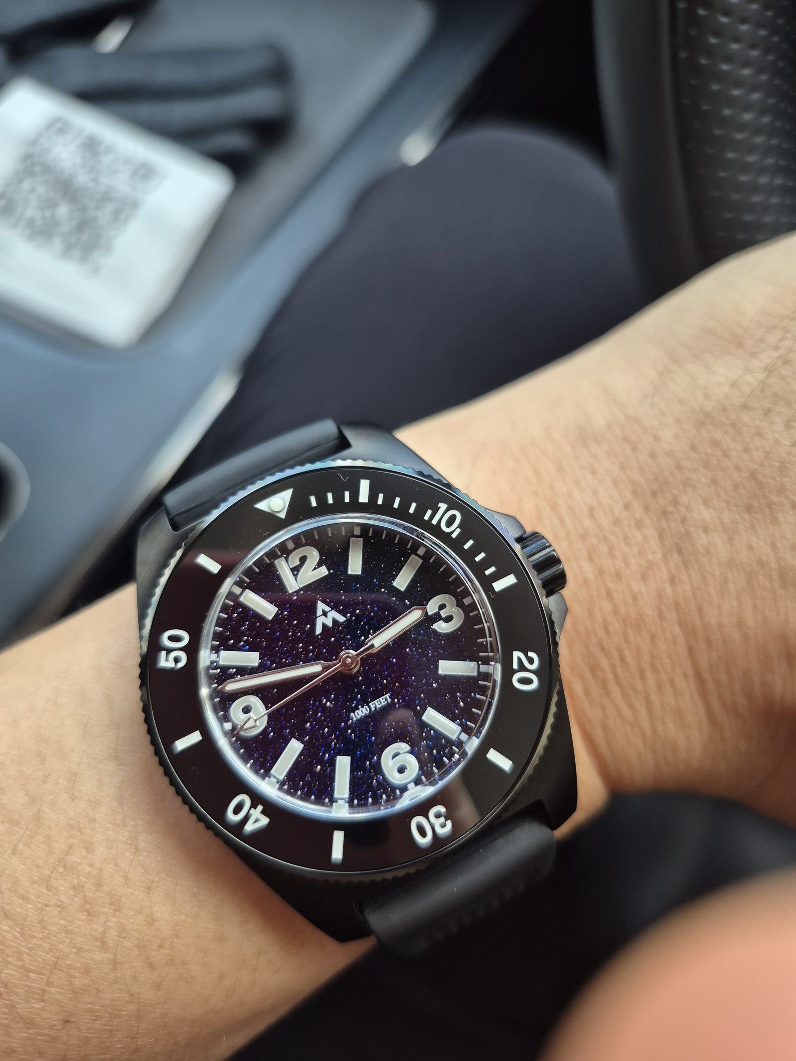 ANIMO Sport Diver, DLC Black/Midnight, worn on the wrist — real production photo